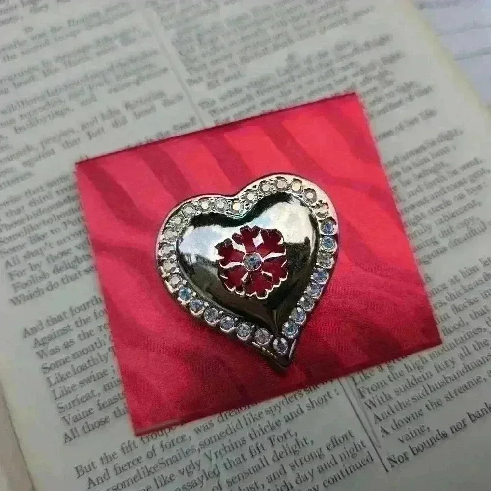 Heart brooch with snowflake design